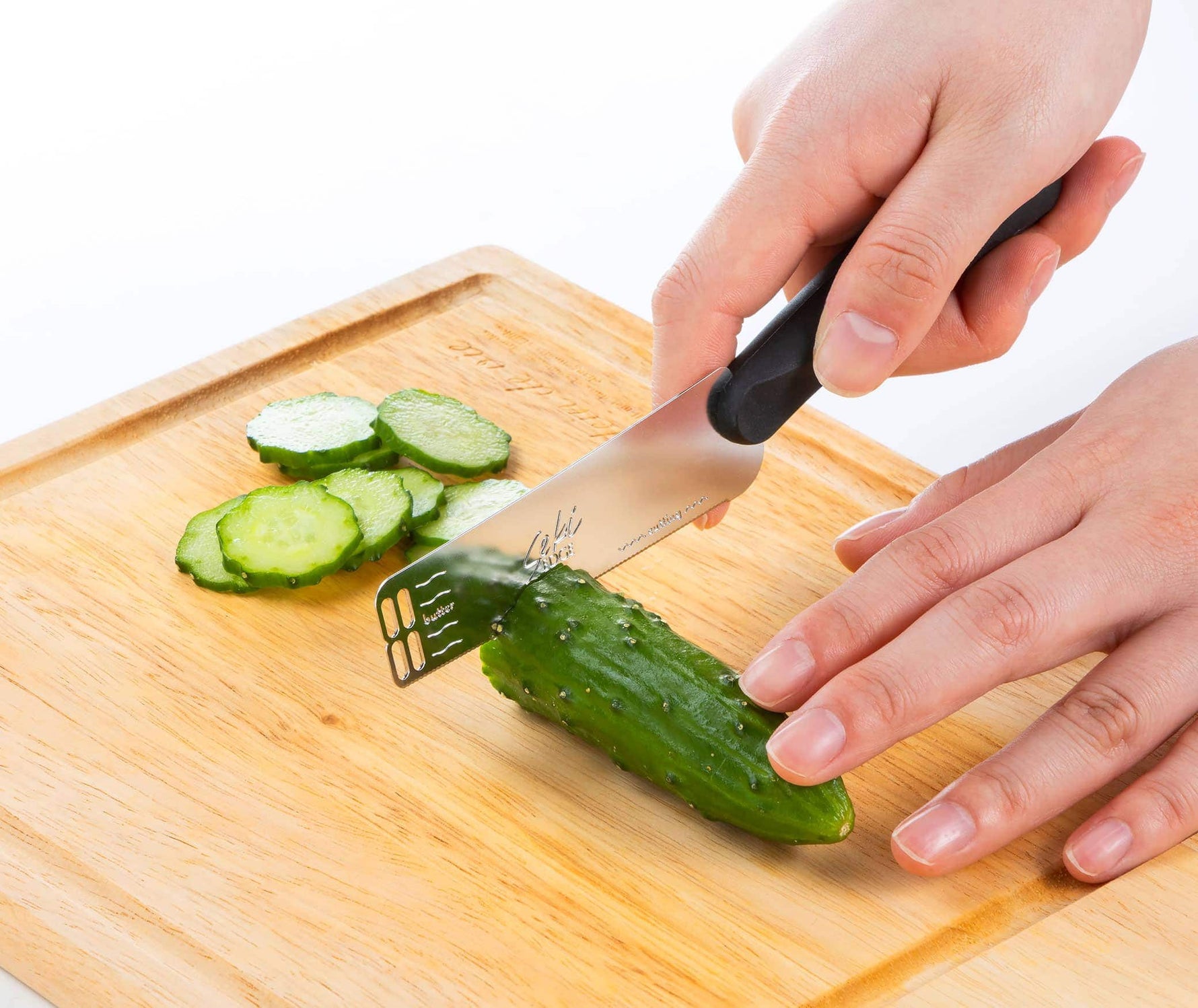 Seki Edge Butter Peeler and Knife SJ-K380 - cutting cucumbers